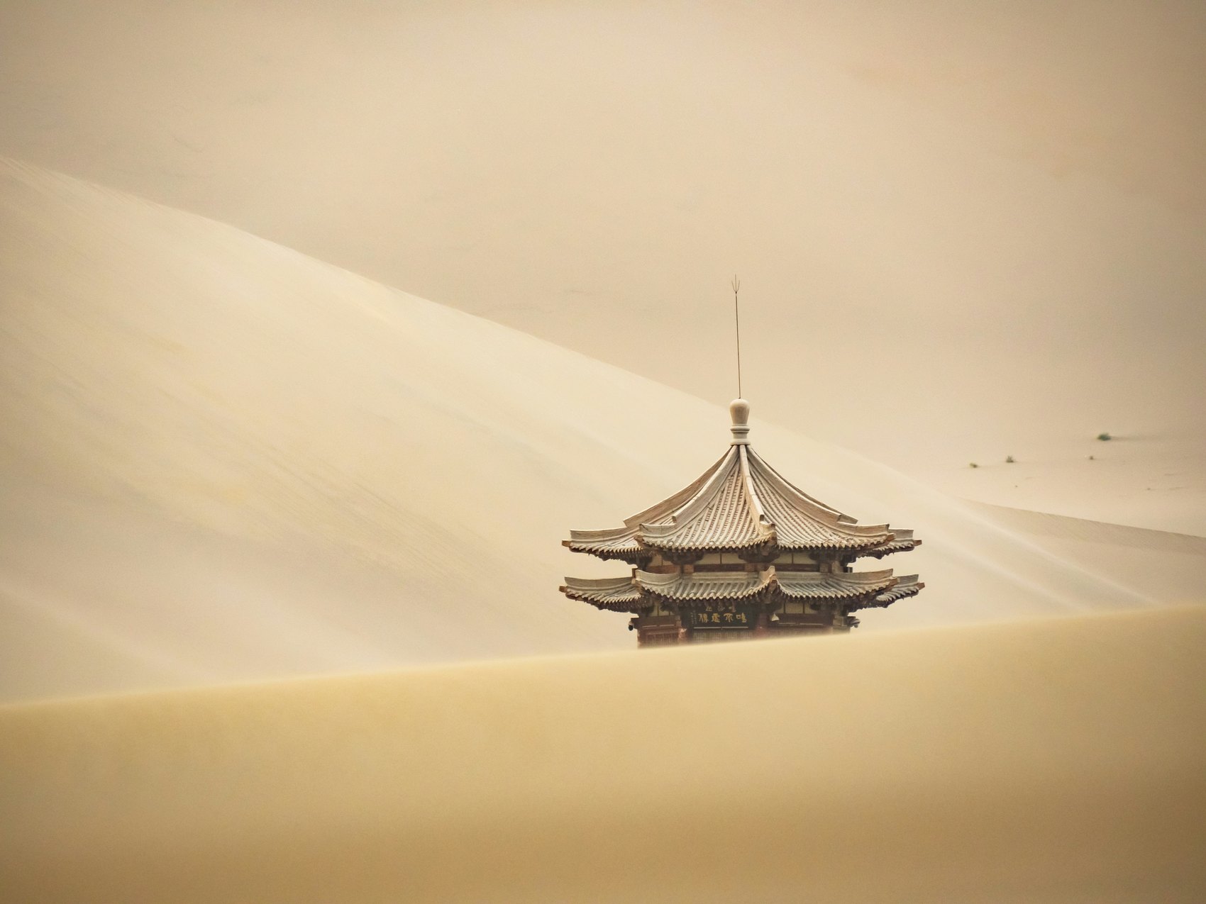 Traditional roof and desert dunes